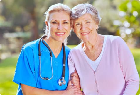 nurse and elderly woman smiling
